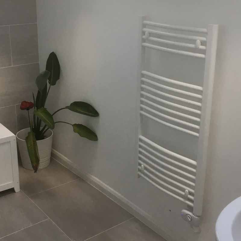 Smart electric towel rail in a bathroom